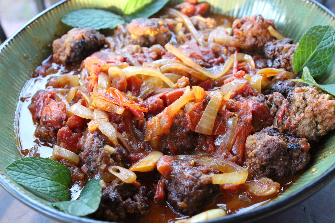 Meatballs garnished with mint