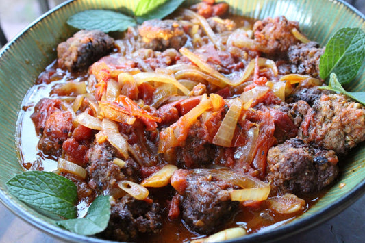 Meatballs garnished with mint